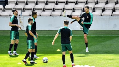 Teammates watch Portugal's Cristiano Ronaldo, right. AP Photo