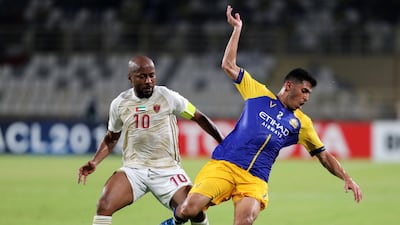 Ismail Matar of Al Wahda and Sultan Al Ghanam of Al Nassr battle during the match. Chris Whiteoak / The National