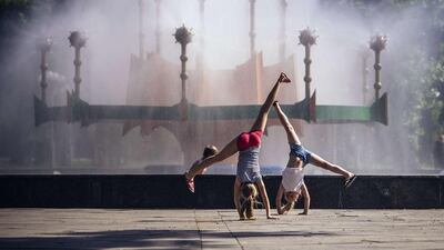 Girls play in a park in the eastern Ukrainian city of Lugansk. Dimitar Dilkoff / AFP Photo