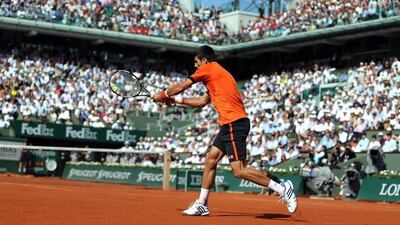 Novak Djokovic returns a shot to Rafael Nadal during his quarter-final victory on Wednesday. Yoan Valat / EPA / June 3, 2015