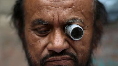 A man repairs a watch at a roadside shop in the old quarters of Delhi. Adnan Abidi / Reuters