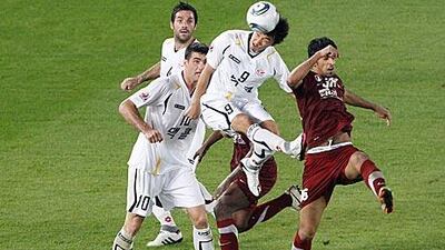 Hamadan al Kamali, right, the Al Wahda defender, clears the ball during an attack by Seongnam. The defender was badly at fault, along with his goalkeeper, for at least two of the South Korean goals.