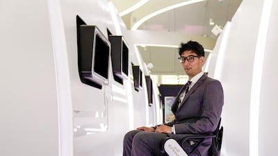 James de Groot, project manager at Etihad, demonstrates the new autonomous wheelchair being trialled at Abu Dhabi Airport in December. Victor Besa / The National