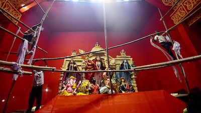 Workers in Allahabad set up a tent for celebrations of the Hindu festival of Durga Puja. AFP