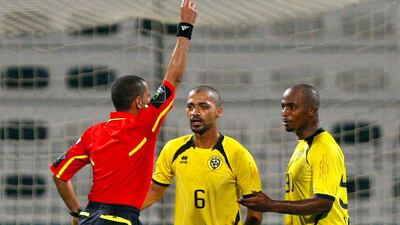 Idris Fawzi Johar of Kalba is shown a red card. Jake Badger / The National