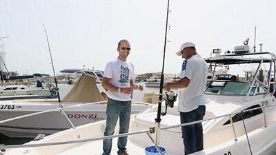 Abdullah Alshalabi, left, is the co-founder and managing director at Fishfishme.com, which runs fishing charters across the world. Delores Johnson / The National