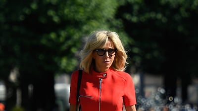 Brigitte, wearing a red Louis Vuitton dress with a full-length zip, at Mirabell Park in Salzburg, on August 23, 2017. AFP