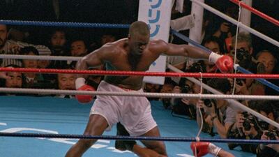 Buster Doublas defeats Mike Tyson in 1990: In this Sunday, Feb. 11, 1990 file photo, James “Buster” Douglas, stands over Mike Tyson, who fell on his back after taking a series of blows in the 10th round of their world heavyweight title fight in Tokyo. (AP Photo/Tsugufumi Matsumoto, File)