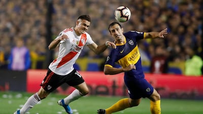 Carlos Izquierdoz of Boca Juniors, right, and Rafael Borre of River Plate vie for the ball during a Copa Libertadores semifinal second leg soccer match at La Bombonera stadium in Buenos Aires, Argentina, Tuesday, Oct. 22, 2019. (AP Photo/Natacha Pisarenko)