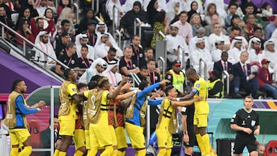 Enner Valencia (R) celebrates with teammates after the second. AFP