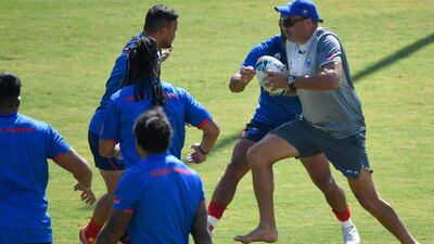 Samoa's head coach Steve Jackson right, training with his players. AFP
