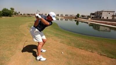 The Jumeirah Golf Estates teaching professional, Wayne Johnson, tees up on the challenging 17th hole at the Greg Norman-designed Earth Course.
