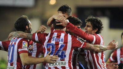 Atletico Madrid's players celebrate the winning goal during their La Liga match v Granada at the Vicente Calderon Stadium in Madrid on Wednesday. Pedro Armestre / AFP / March 26, 2014