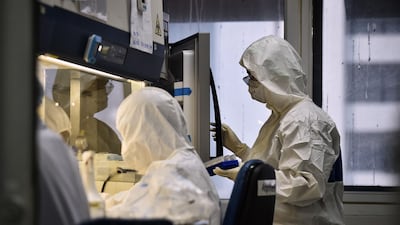 Lab technicians test patient samples for the novel coronavirus at the Centre for Emerging Infectious Diseases of Thailand at Chulalongkorn University in Bangkok. AFP
