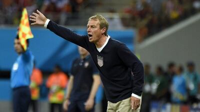 Jurgen Klinsmann instructs his US team on during their Group G match against Portugal. ODD Andersen / AFP Photo