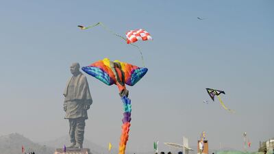 Indian and foreign participants fly kites during the 30th International Kite Festival. AFP