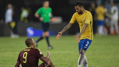 Brazil full-back Dani Alves, rights, approaches Venezuela striker Salomon Rondon after the match. Juan Barreto / AFP