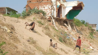 Houses after houses, with their cracked walls and broken sills have long been abandoned by their inhabitants in the ghost village situated less than 200 metres from the shore.