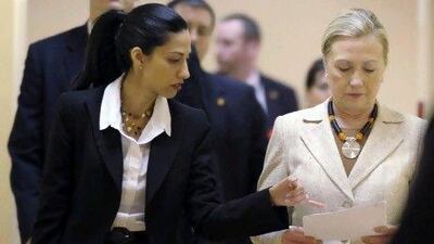 US secretary of state Hillary Rodham Clinton goes over notes with Huma Abedin, one of her senior advisors.