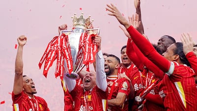 Liverpool manager Arne Slot lifts the Premier League. PA