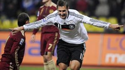 Miroslav Klose celebrates scoring the only goal against Russia at Moscow's Luzhniki Stadium, which put Germany through to the World Cup.