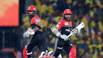 Royal Challengers Bangalore captain Virat Kohli, left, and Parthiv Patel run between the wickets to score during the VIVO IPL T20 cricket match between Chennai Super Kings and Royal Challengers Bangalore in Chennai, India. AP Photo