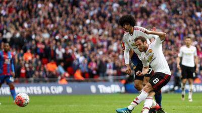 Juan Mata of Manchester United (8) scores their first goal during the FA Cup Final match between Manchester United and Crystal Palace at Wembley Stadium on May 21, 2016 in London, England. (Paul Gilham/Getty Images)