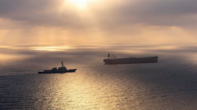 The Arleigh Burke-class destroyer USS Rafael Peralta tails the Iran-flagged crude oil tanker vessel Herby as its sails towards an Iranian port. AFP