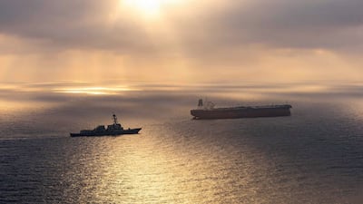 The Arleigh Burke-class destroyer USS Rafael Peralta tails the Iran-flagged crude oil tanker vessel Herby as its sails towards an Iranian port. AFP
