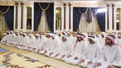 (R - L) Sheikh Mohammed bin Saud, Crown Prince and Deputy Ruler of Ras Al Khaimah, Lt Gen Sheikh Saif bin Zayed, Deputy Prime Minister and Minister of Interior, Sheikh Ammar bin Humaid, Crown Prince of Ajman, Sheikh Hamdan bin Rashid Deputy Ruler of Dubai and Minister of Finance and Industry, Sheikh Saud bin Saqr, Ruler of Ras Al Khaimah, Sheikh Mohammed bin Zayed, Crown Prince of Abu Dhabi and Deputy Supreme Commander of the Armed Forces, Dr Sheikh Sultan bin Mohammed, Ruler of Sharjah, Sheikh Humaid bin Rashid, Ruler of Ajman, Sheikh Hamad bin Mohammed, Ruler of Fujairah, Sheikh Mohammed bin Rashid, Vice President and Ruler of Dubai, Sheikh Saud bin Rashid, Ruler of Umm Al Quwain, and Sheikh Hamdan bin Mohammed Al Maktoum, Crown Prince of Dubai, pray during an Iftar reception at Al Mushrif Palace. Ryan Carter / Crown Prince Court - Abu Dhabi