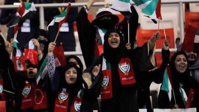 Female fans cheer on the national team after a goal against Bahrain in Tuesday's Gulf Cup match. Their presence at the game caused a stir on Twitter, with tweeters condemning and praising their attendance. Hamad I Mohammed / Reuters
