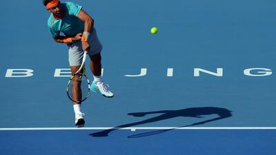 Rafael Nadal of Spain serves a point as he makes his return to action at the China Open in the National Tennis Center of Beijing on September 29, 2014. Goh Chai Hin / AFP