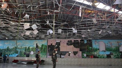 Afghan soldiers inspect a damaged Dubai City wedding hall after an explosion in Kabul, Afghanistan. AP