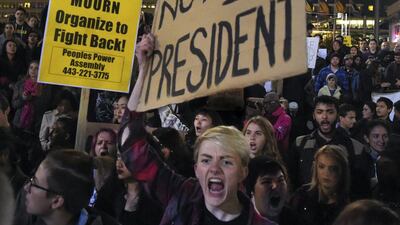 Anti-Donald Trump protesters march from the Washington Monument to Inner Harbor on November 10, 2016, in Baltimore, Maryland, following the unexpected election of the former reality TV star as president of the United States. Loyd Fox / Baltimore Sun via AP