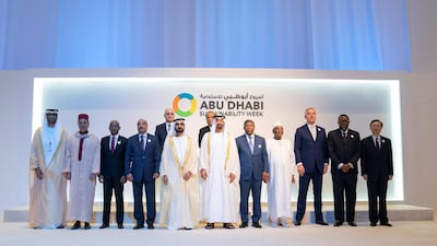 Sheikh Mohamed bin Rashid and Sheikh Mohamed bin Zayed stand for a photograph with for a group photo with Heads of State, during the opening ceremony of the World Future Energy Summit. Seen with Dr Sultan Ahmed Al Jaber, Moulay Rachid (2nd L), Ibrahim Solih, President of the Maldives (3rd L), Mohamed Abdel Aziz, President of Mauritania (4th L), Joao Lourenco, President of Angola (7th L), Ibrahim Keita, President of Mali (8th L), Milo Djukanovic, President of Montenegro (9th L), Hage Geingob, President of Namibia (10th L), Yang Jiechi, Special Representative of the Chinese President (L), Shahin Mustafayev, Minister of Economic Development of Azerbaijan (2nd row L) and Taneti Mamau, President of Kiribati (2nd row R). Mohamed Al Hammadi / Ministry of Presidential Affairs