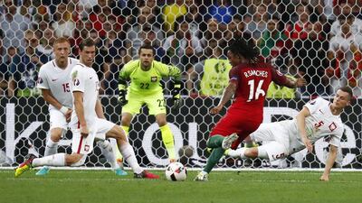 Portugal midfielder Renato Sanches scores the equalising goal. Kai Pfaffenbach / Reuters