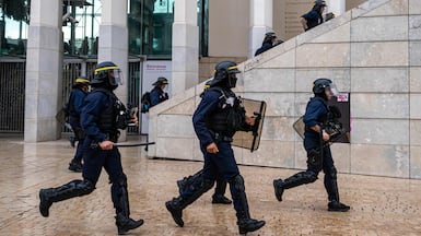 Police officers charge at pupils at Saint-Charles train station amid high school and youth protests, in Marseille, southern France. AFP
