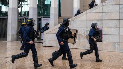 Police officers charge at pupils at Saint-Charles train station amid high school and youth protests, in Marseille, southern France. AFP