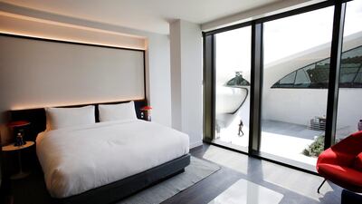 A room at the TWA Hotel at New York's John F Kennedy International Airport has a view of the Eero Saarinen-designed terminal. AP Photo / Mark Lennihan