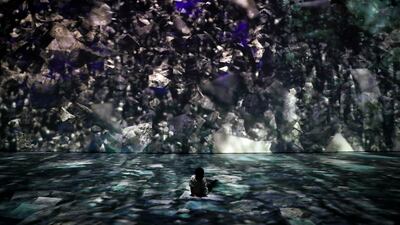 A child watches an audio-visual art installation titled "cornerstone" during The Future of Today Exhibition at Today Art Museum in Beijing. Andy Wong / AP photo