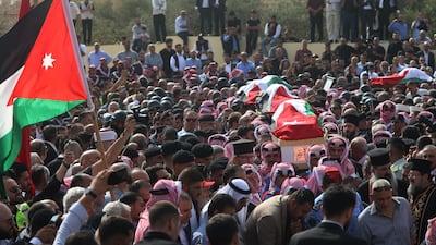 Hundreds of Jordanians attend a funeral service for the victims of the church attack in Hamoud. Getty Images