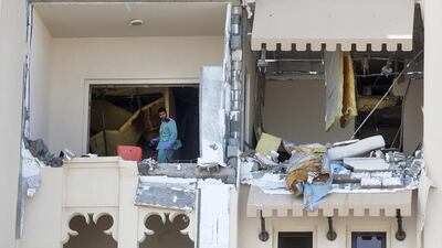 A police officer investigates the scene of a gas explosion at the Saadiyat Beach Residences in Abu Dhabi. Christopher Pike / The National
