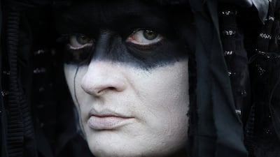 An Extinction Rebellion activist dressed as an oil slick attends a protest in Windsor, near London. Reuters
