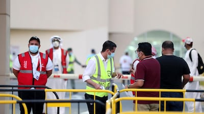 Fans have their temperature taken before the game. Chris Whiteoak / The National.