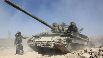 Pro Syrian regime forces are seen as they advance towards the town of Douma, the last opposition holdout in Eastern Ghouta, on April 7