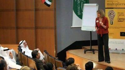 Liz Wiseman speaks to an audience of managers at the National Bank of Abu Dhabi.