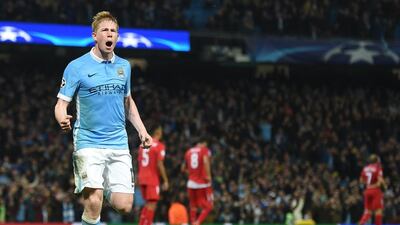 Manchester City’s Kevin de Bruyne celebrates after scoring the added time winner against Sevilla on Wednesday night in the Champions League. Paul Ellis / AFP