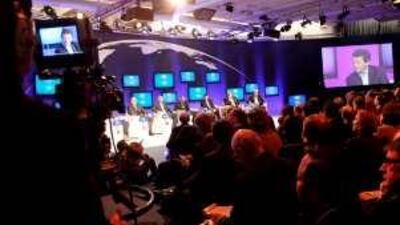Participants attend a session on the second day of the World Economic Forum in Davos, including Khalid al Falih, centre in panel , the chairman and chief executive of Saudi Aramco.