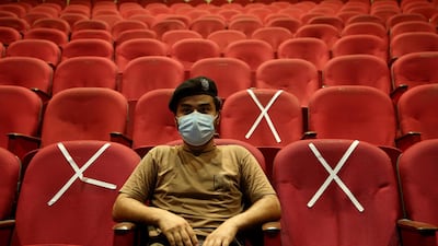 A police officer waits his turn to receive the Convidecia Covid-19 vaccine at a vaccination centre in Peshawar, Pakistan. AP Photo