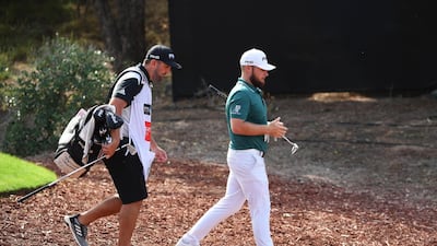 DUBAI, UNITED ARAB EMIRATES - NOVEMBER 16: Tyrrell Hatton of England and caddie walk off the 4th tee during day two of the DP World Tour Championship at Jumeirah Golf Estates on November 16, 2018 in Dubai, United Arab Emirates. (Photo by Ross Kinnaird/Getty Images)